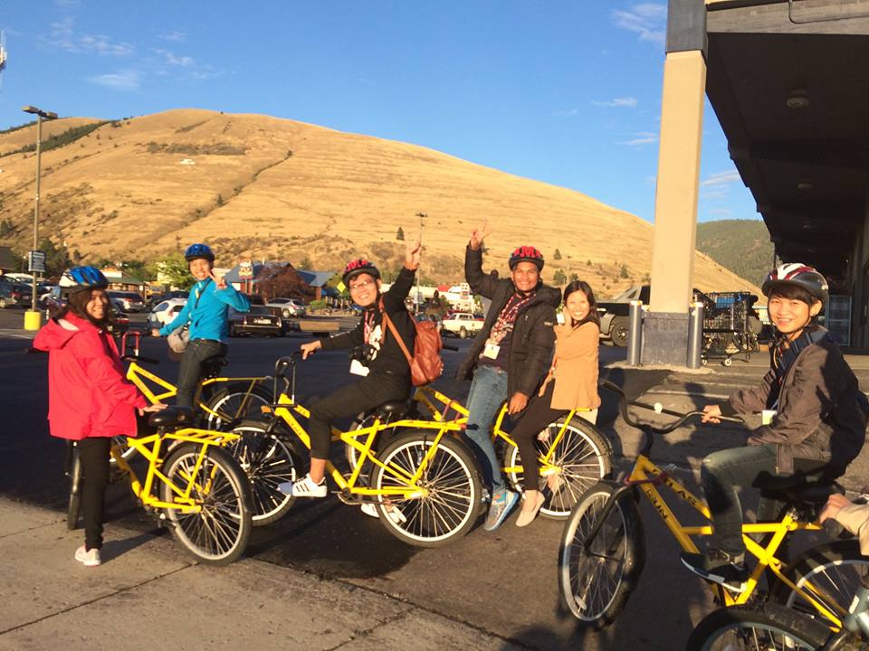 A group of fellows getting ready to ride yellow bikes in Missoula MT