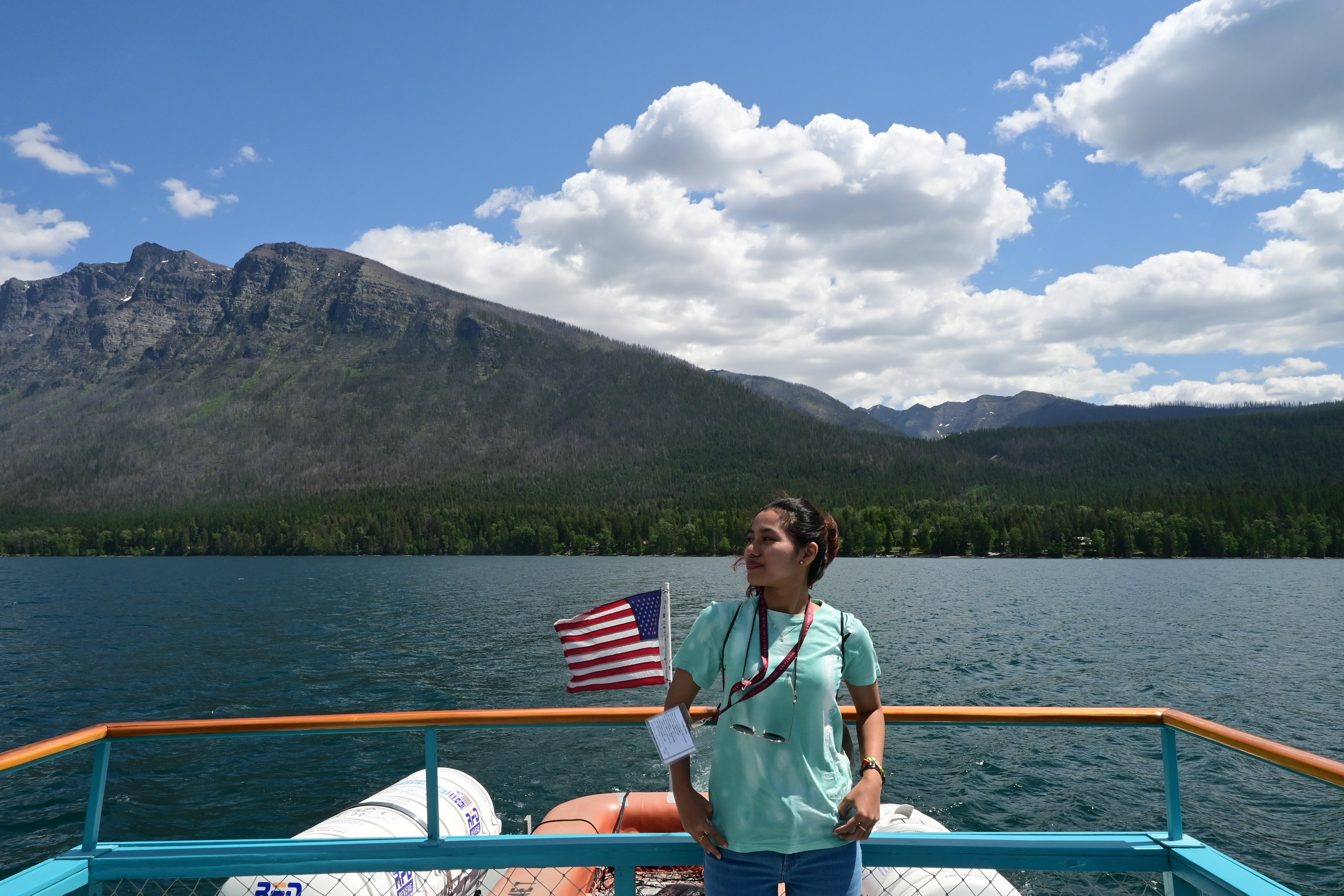 An image af a fellow on a boat in Glacier National Park