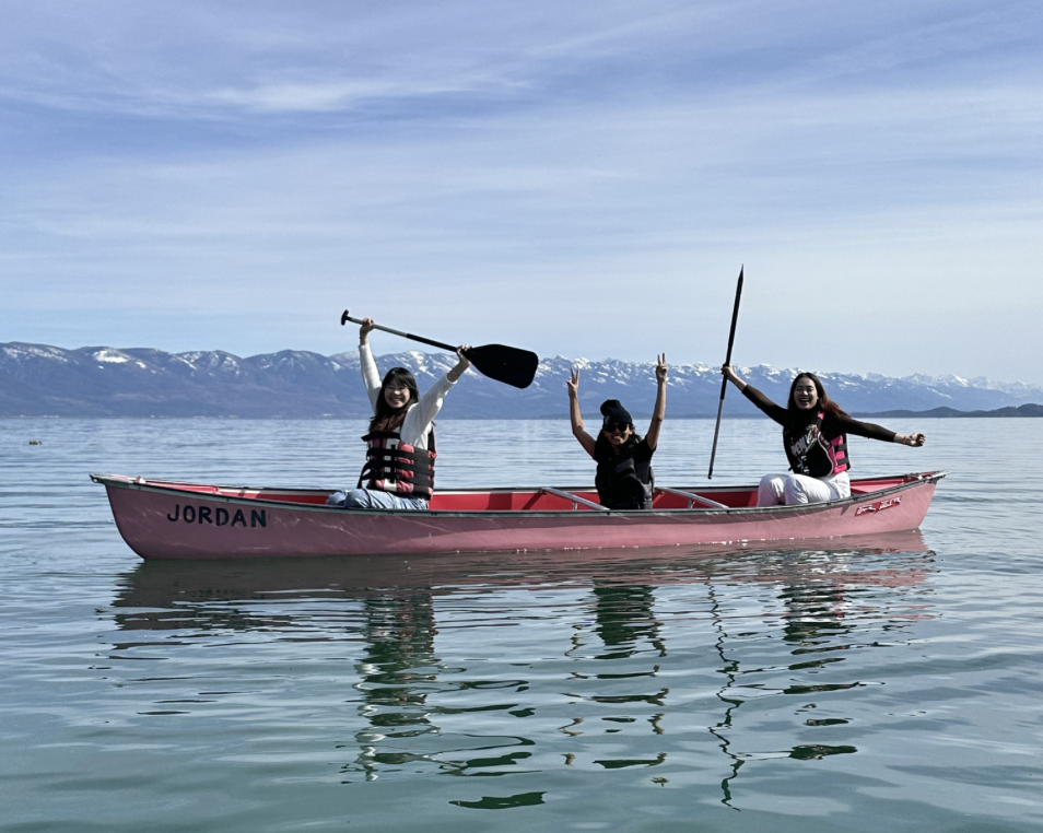 Three fellows on a canoe together on Flathead lake