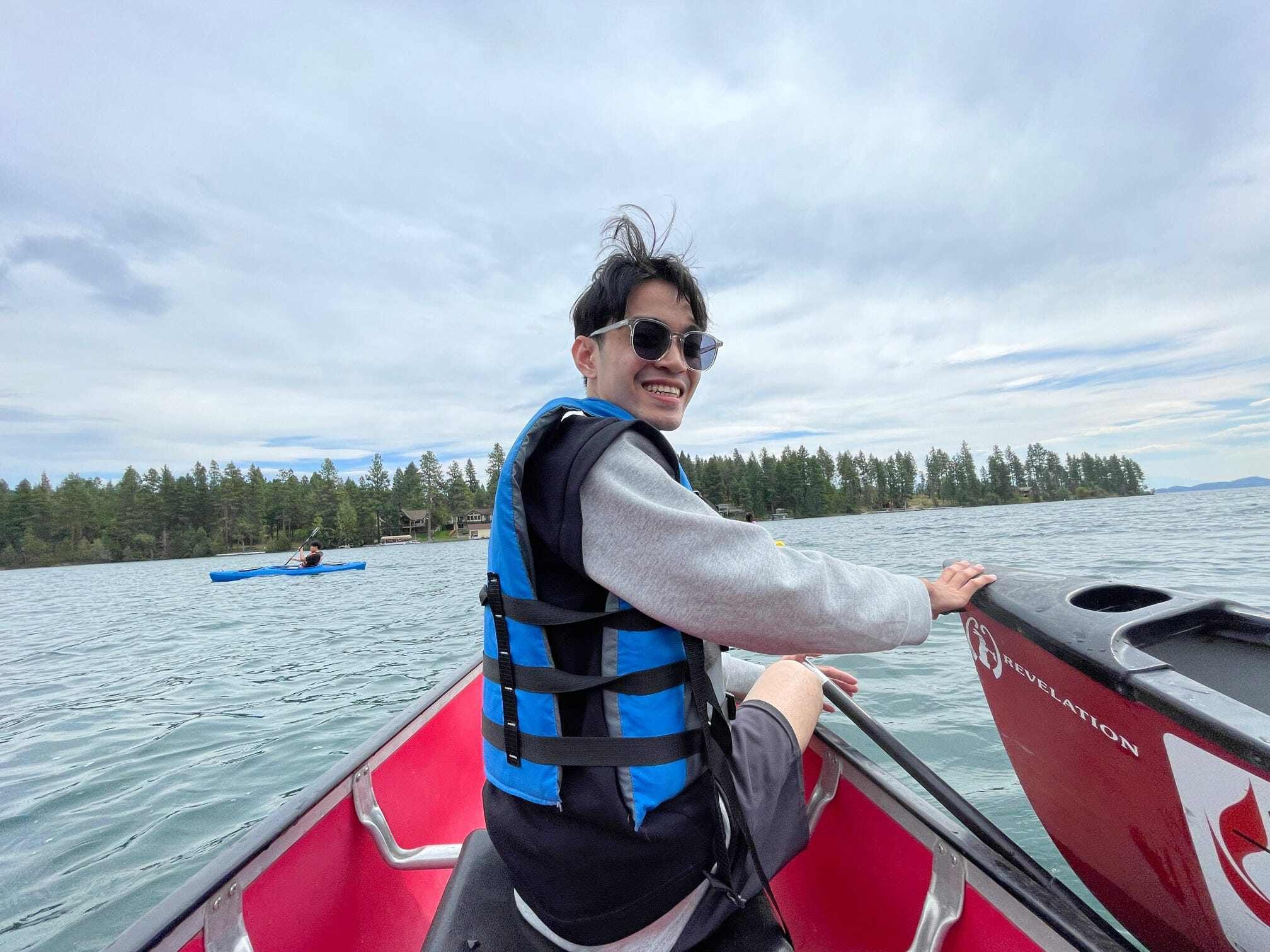 A fellow named Sim from Cambodia riding a kayak on Flathead lake